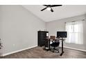 Bedroom with a fan, a desk, and a window allowing natural light at 13111 Fruitville Way, Riverview, FL 33579