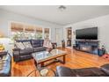 Spacious living room featuring a leather sofa, hardwood floors, and plenty of natural light at 243 Snell Isle Ne Blvd, St Petersburg, FL 33704