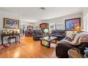 Cozy living room with hardwood floors, two sofas, and a dining room set at 243 Snell Isle Ne Blvd, St Petersburg, FL 33704