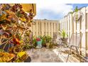 Private outdoor patio with a painted fence, seating and charming decor at 2922 60Th W St, Bradenton, FL 34209
