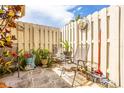 Private outdoor patio with a painted fence, seating and charming decor at 2922 60Th W St, Bradenton, FL 34209