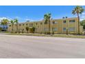 Charming exterior view of the apartments featuring a well-manicured lawn and ample parking at 3206 W Azeele St # 120, Tampa, FL 33609