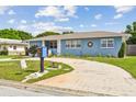 Well-maintained home with a circular driveway and attractive landscaping at 4211 28Th N Ave, St Petersburg, FL 33713