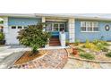 Charming home with lush landscaping and a brick walkway to the porch at 4211 28Th N Ave, St Petersburg, FL 33713