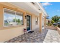 Charming front porch area with decorative tile flooring and welcoming entrance at 4414 W Hanna Ave, Tampa, FL 33614