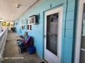 Welcoming entrance to unit #11 with a cozy, covered walkway and convenient access at 505 67Th Ave # 11, St Pete Beach, FL 33706