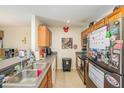 Functional kitchen featuring stainless steel appliances and ample cabinet space at 5501 67Th N Ave # 11, Pinellas Park, FL 33781
