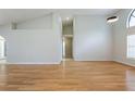 Expansive living room with hardwood floors and high ceilings, perfect for entertaining at 6123 India Dr, Spring Hill, FL 34608