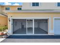 Spacious garage featuring a screened-in door and ample storage space at 6400 46Th N Ave # 61, Kenneth City, FL 33709
