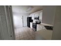 Functional kitchen featuring a full suite of black appliances and ample counter space at 10024 Cedar Dune Dr, Tampa, FL 33624