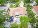 Aerial view of a well-maintained single-Gathering home with a spacious backyard, gazebo, and mature trees at 113 Maplewood Ave, Clearwater, FL 33765