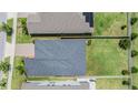 Overhead view of a home showcasing its roof, yard, and proximity to neighboring properties at 11315 Chilly Water Ct, Riverview, FL 33579