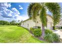 Well-maintained single story home with a lush lawn and mature trees at 11619 Cambium Crown Dr, Riverview, FL 33569