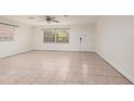 Spacious living room with neutral tile flooring and a window providing natural light at 121 28Th N Ave, St Petersburg, FL 33704