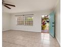 Bright and airy living room featuring neutral tile floors and a large window at 121 28Th N Ave, St Petersburg, FL 33704