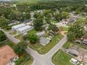 Beautiful aerial shot highlights community, showcasing well-spaced homes, green spaces, and the tranquil neighborhood layout at 12324 Pittsfield Ave, Tampa, FL 33624