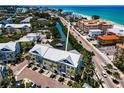 Overhead aerial view of coastal condos in Indian Rocks Beach, Florida, featuring beach access, boat docks and garages at 208 Haven Beach Ct, Indian Rocks Beach, FL 33785
