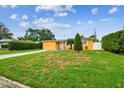 Inviting single-story home with a well-manicured lawn and charming curb appeal at 2818 Lorraine St, Tampa, FL 33614