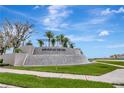 Winding Ridge community entrance sign with flowing water feature on a bright, sunny day at 3060 Mountain Spruce Ter, Wesley Chapel, FL 33543