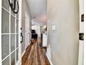 Inviting entryway featuring wood-look flooring and views into the living area at 310 S Willow Ave # A, Tampa, FL 33606