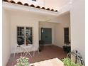 Inviting courtyard featuring seating, table, and a double door entrance at 3145 Lake Ellen Dr # 3145, Tampa, FL 33618