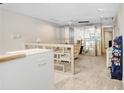 Open-concept living area with neutral decor and staircase access at 3145 Lake Ellen Dr # 3145, Tampa, FL 33618