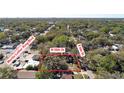 Aerial view of property with trees, streets, and neighborhood landmarks with property boundaries clearly shown at 4009 N 15Th St, Tampa, FL 33610