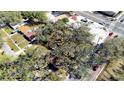 Aerial view of the home with mature trees, surrounded by other houses and streets at 4009 N 15Th St, Tampa, FL 33610