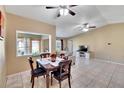 Bright dining area showcasing tile flooring and seamless flow into the living room at 4085 105Th N Ave, Clearwater, FL 33762