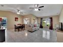 Spacious living room featuring tile floors, high ceilings, and lots of natural light at 4085 105Th N Ave, Clearwater, FL 33762