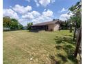 Expansive backyard featuring a screened lanai, perfect for outdoor enjoyment and relaxation at 432 Flamingo Dr, Apollo Beach, FL 33572