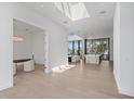 Open-concept living room featuring sleek finishes and an abundance of natural light at 501 Barcelona Dr, Tierra Verde, FL 33715