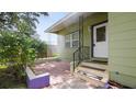 Inviting front porch with tiled steps and decorative iron railings at 5725 18Th S Ave, Gulfport, FL 33707