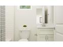 Spotless bathroom design includes a white vanity, toilet, and bath with neutral finishes, and modern accents at 6611 Active Run, New Port Richey, FL 34653