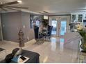 Contemporary dining area featuring stylish chairs, modern lighting, and white marble floors at 9161 56 Th, Pinellas Park, FL 33782