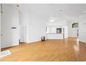 Bright, airy living room with vaulted ceiling, wood floors, and an open floor plan at 10462 Lucaya Dr, Tampa, FL 33647