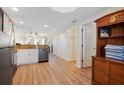Open kitchen with wood-look floors flows to the living spaces and ample closet storage at 12000 Gulf Blvd # 403-S, Treasure Island, FL 33706