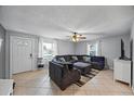 Bright living room with tile flooring and lots of seating at 12660 118Th St, Largo, FL 33778