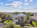 An aerial view of a two-story home and surrounding neighborhood, highlighting the property's location at 1314 Oak Pond St, Ruskin, FL 33570