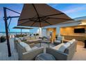 Luxurious rooftop lounge area with plush seating, bar, and stunning panoramic views at 1581 Gulf Blvd # 701N, Clearwater Beach, FL 33767