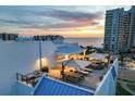 Inviting rooftop patio with comfortable seating, perfect for enjoying ocean views and sunsets at 1581 Gulf Blvd # 701N, Clearwater Beach, FL 33767