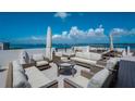 Beautiful rooftop seating with comfortable furnishings and breathtaking ocean views at 1581 Gulf Blvd # 701N, Clearwater Beach, FL 33767