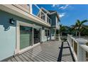An inviting back deck featuring a modern railing system and ample space for outdoor enjoyment at 160 Shore Dr, Palm Harbor, FL 34683