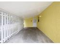 Covered carport area with a concrete floor and access to the home's entrance at 1903 24Th St, Sarasota, FL 34234