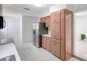 Kitchen with stainless steel refrigerator and a good amount of cabinet space at 1903 24Th St, Sarasota, FL 34234
