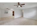 Spacious living room features neutral walls, tile flooring, and bright lighting at 1903 24Th St, Sarasota, FL 34234