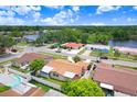 Lovely residential neighborhood with mature trees and ponds at 2119 Sugarbush Dr, Holiday, FL 34690
