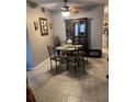 The dining area features a round dining table, seating for six, and decorative furnishings at 2466 Ecuadorian Way # 32, Clearwater, FL 33763