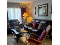 A cozy living room features comfortable seating and stylish décor elements at 2466 Ecuadorian Way # 32, Clearwater, FL 33763