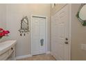Entryway featuring tile flooring, a closet, decor and neutral-toned walls at 247 Los Prados Dr # 1123, Safety Harbor, FL 34695